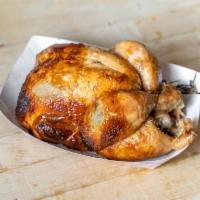 Whole Rotisserie Chicken · Fire-roasted over simmering water that ensures a moist and tender bird!