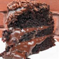 Cake Slice · Our most popular cake: dark chocolate cake with chocolate brigadeiro filling, topped with ch...