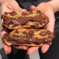 Cookie Sandwich · Two chocolate chip cookies with a soft chocolate brigadeiro filling