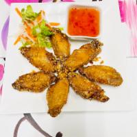 A5. Marinated Fish Sauce Chicken Wings ( 7) · Crispy wings tossed with garlic and house special sauce.