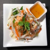 S3. Lotus Root Salad · Served with poached shrimp, lotus root, basil, pickled jicama, daikon, and carrots. Topped w...