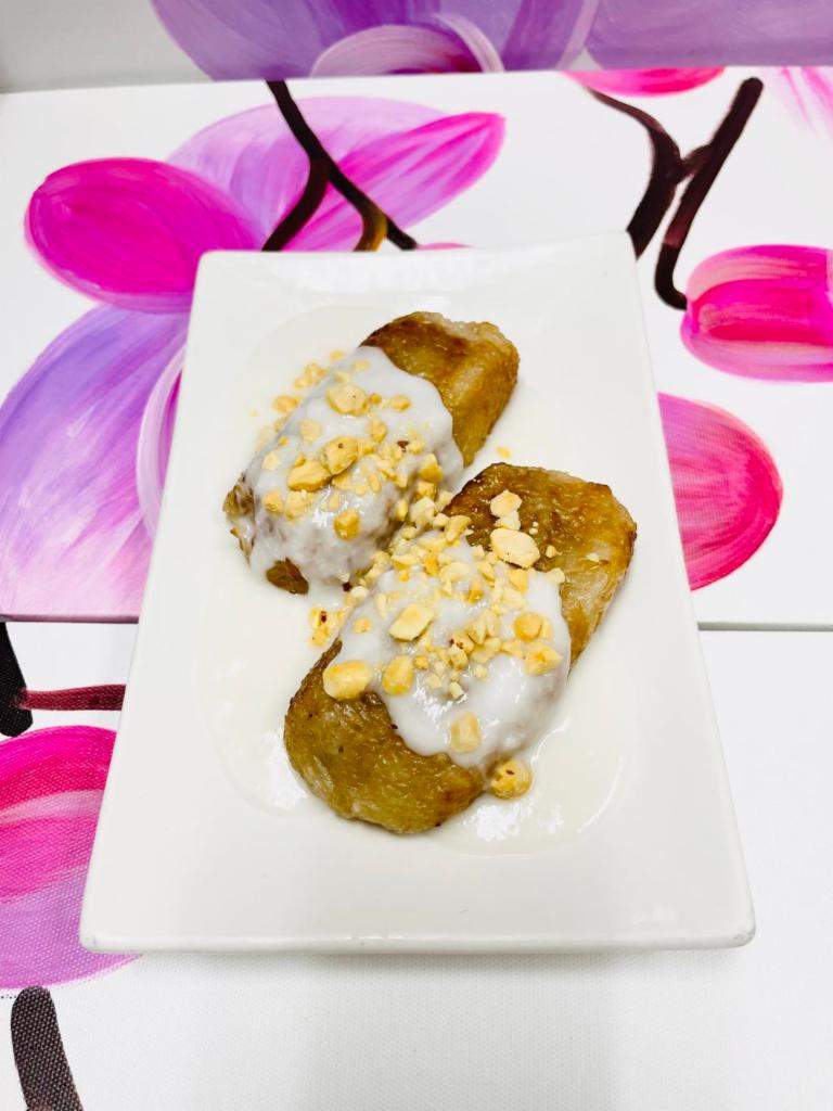 Grilled Banana Cake · Sticky Rice and Banana. Topped With Peanuts and Coconut Milk.