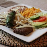 Bisteck Encebollado Platter · Grill steak meat topped with grill onions and grill jalapenos. Served with Mexican rice and ...