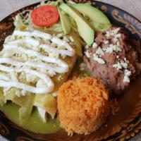 Green Chicken Enchiladas · 3 corn chicken enchiladas topped with salsa verde, queso fresco and sour cream. Served with ...