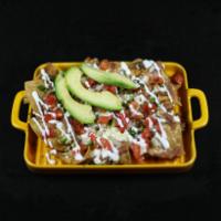 Nixtamal’s Mexican Nachos · Nixtamal Corn Chips with refried beans, Pico de Gallo, melted Oaxaca, Chihuahua Cheeses, Cre...