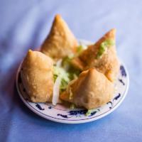 Samosa · Turnover filled with vegetable, meat or coconut.