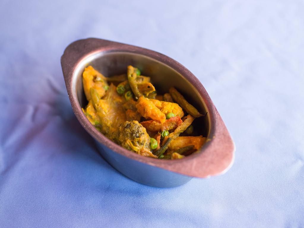 Mixed Vegetable Curry · A combination of fresh vegetable cooked in lightly spiced sauce.