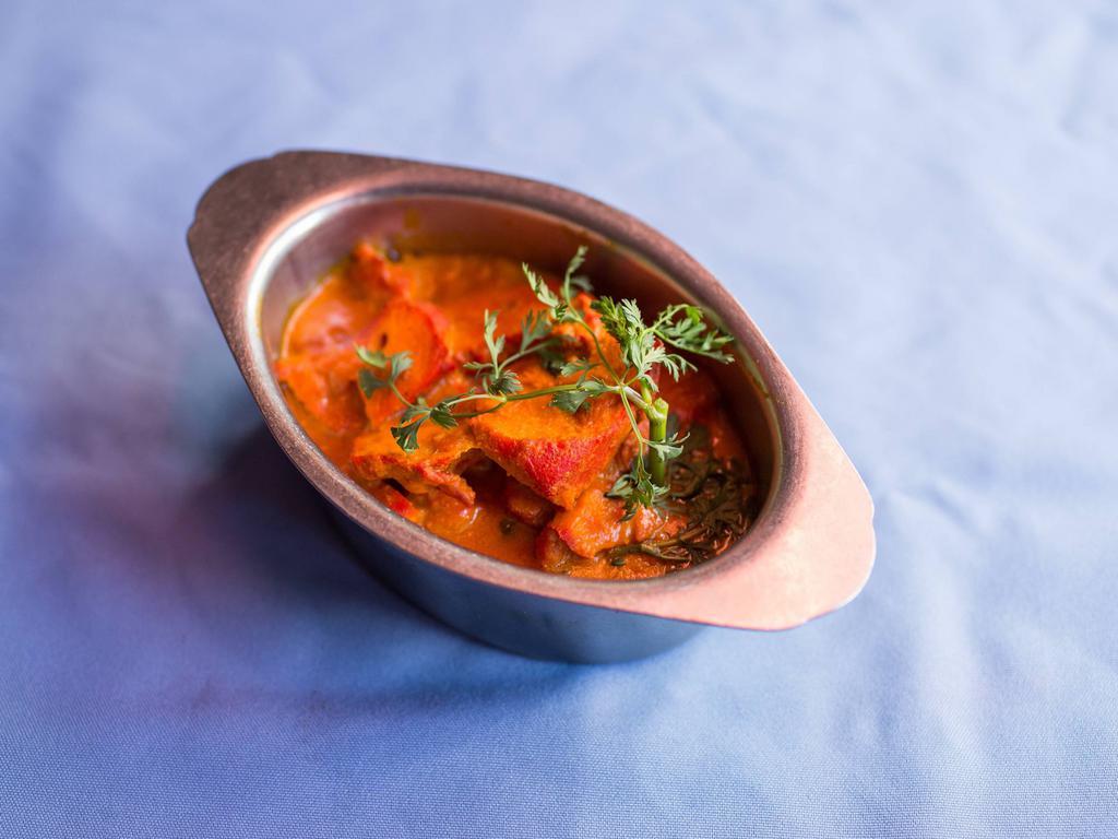 Chicken Tikka Masala · Boneless broiled chicken cubes cooked with a special tandoori mild spicy sauce.