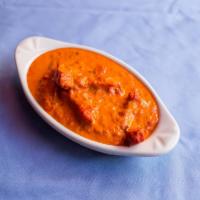 Butter Chicken · Boneless chicken tikka cooked with pure butter, almonds creamy and special sauce.