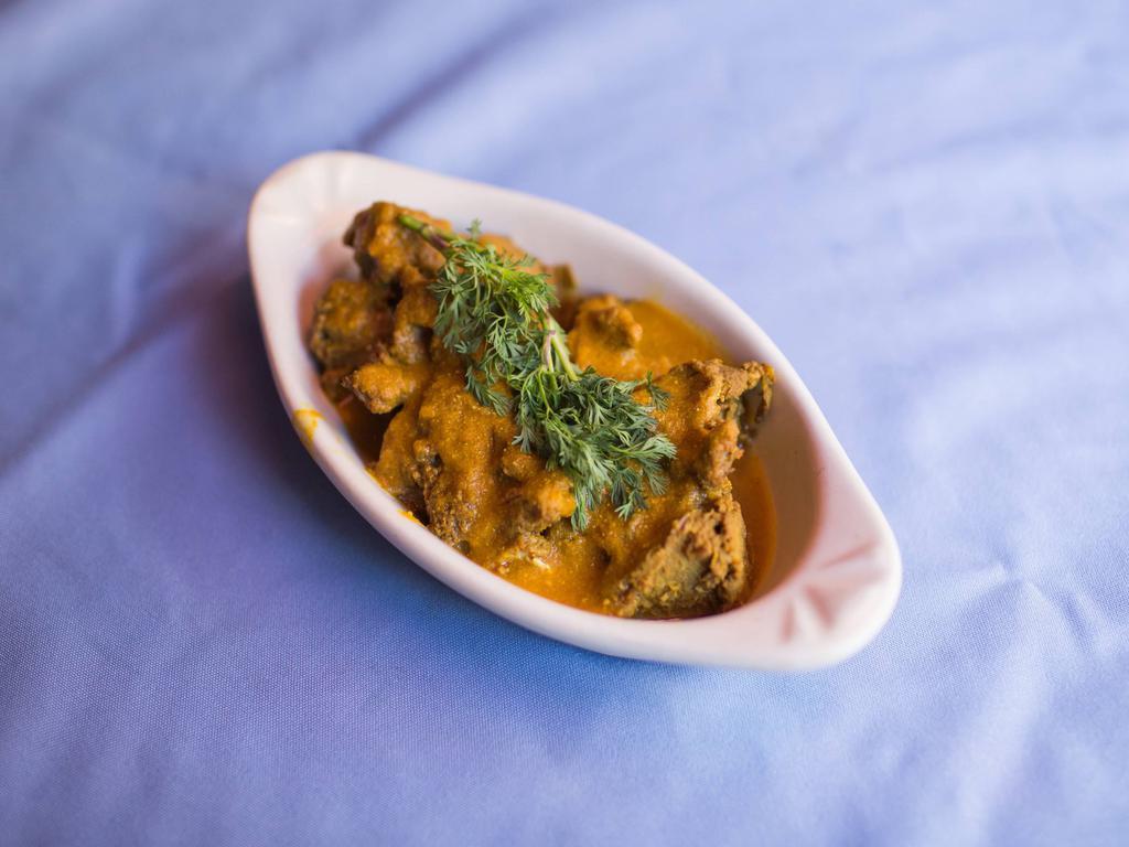 Lamb Curry · Tender pieces of boneless lamb cooked in lightly spiced gravy.