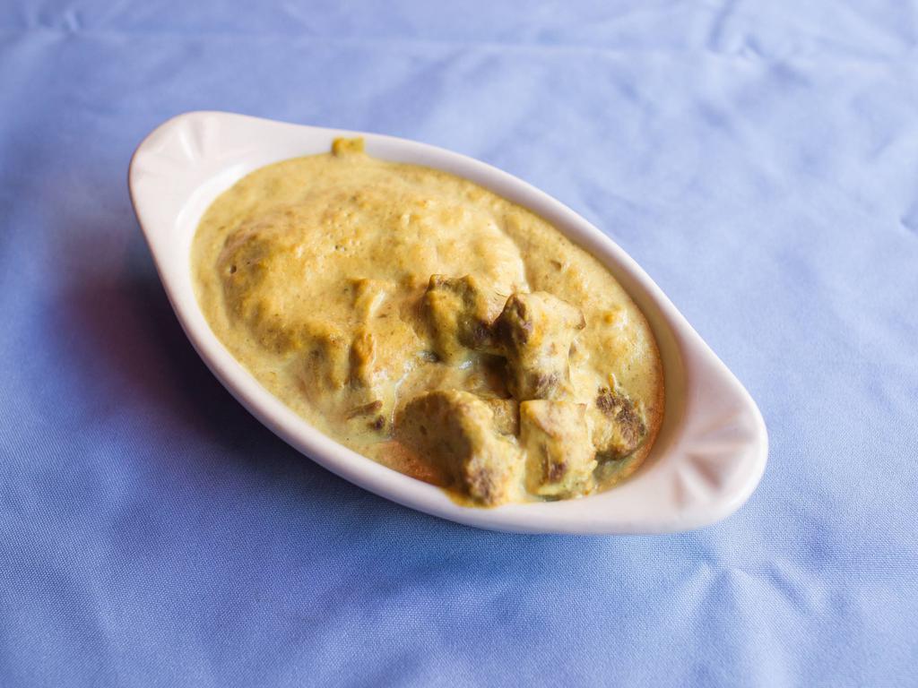 Lamb Kurma · Cooked in mughlai style with almond and mild creamy sauce.