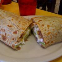 Burrito · A large flour tortilla filled with your choice of meat, lettuce, tomato, and refried beans.