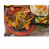 Fajitas Dinner · All fajitas served on top of a sizzling skillet with sauteed bell peppers, onions and tomato...