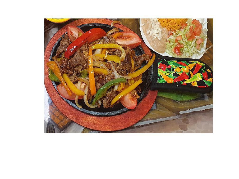 Fajitas Dinner · All fajitas served on top of a sizzling skillet with sauteed bell peppers, onions and tomatoes. Presented with rice, beans, lettuce, pico de gallo, sour cream, guacamole and tortillas. 