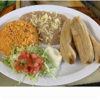 Tamale Dinner  · 3 pork or chicken tamales wrapped in corn husk. Served with lettuce, sour cream and pico de ...