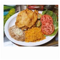 Milanesa Dinner · Seasoned and lightly breaded chicken or steak and fried to perfection. Served with rice, bea...
