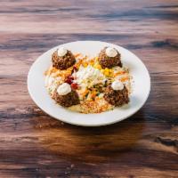 Falafel Plate · 4 falafel balls on a bed of hummus, topped with oil, paprika and toppings of your choice. In...