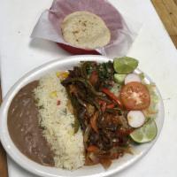 Steak and Onions · Bistec encebollad. Serve with rice, beans, and salad.