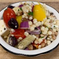 Fregola Salad  · Mediterranean Pasta Salad with sweet bell peppers, artichokes, cucumber, feta cheese, olives...