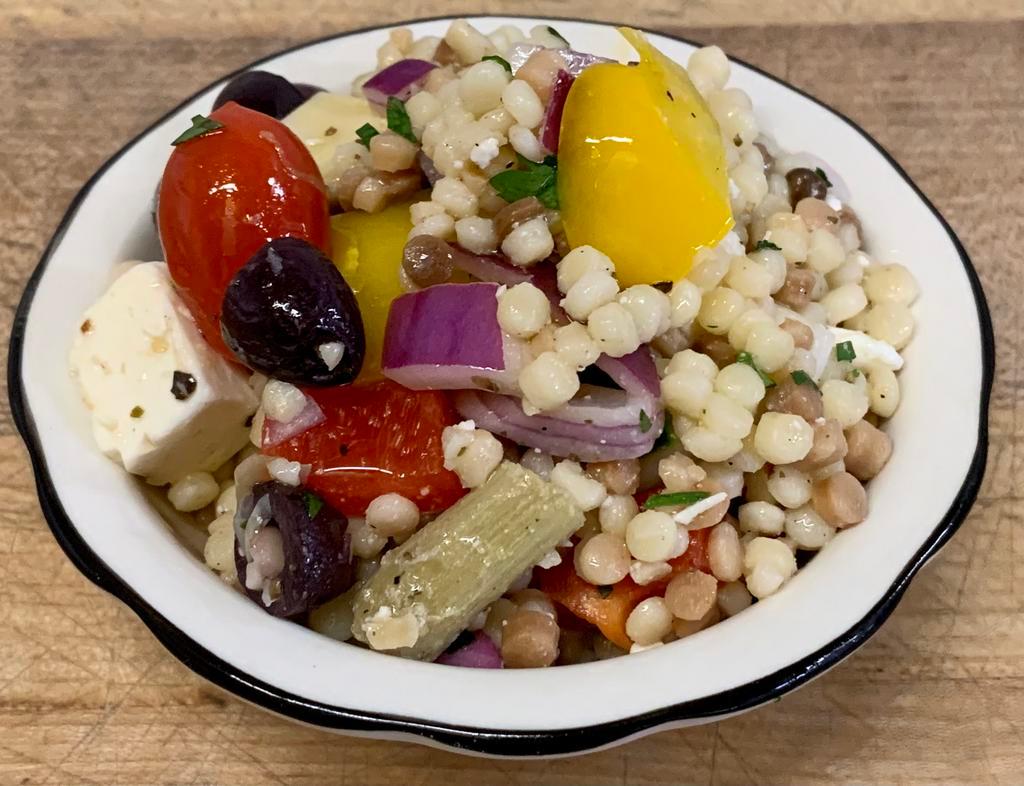 Fregola Salad  · Mediterranean Pasta Salad with sweet bell peppers, artichokes, cucumber, feta cheese, olives & lemon vinaigrette.
