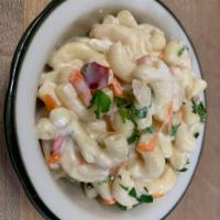Macaroni Salad · Elbow macaroni, mayonnaise, sour cream, carrots, vinegar, herbs and spices.