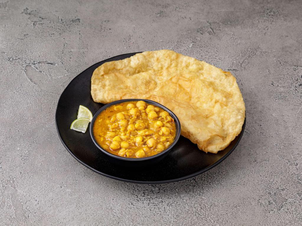 Channa Bhature · Large puffy white flour bread served with chickpeas curry. 