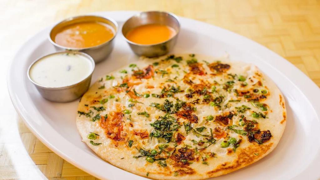 Mix Vegetable Uthappam · Lentil and rice flour pancake topped assorted vegetables