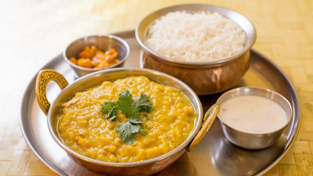 Dal Tadka · Yellow dal cooked on slow flame with onion, garlic & spices