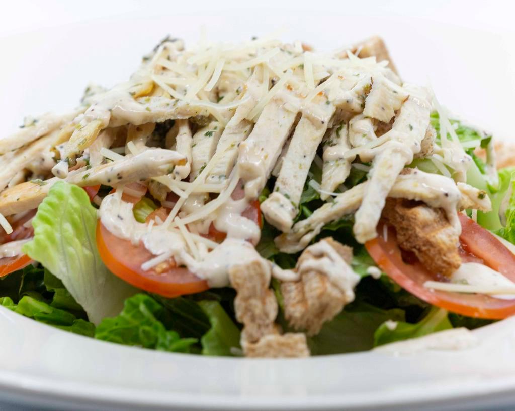 Caesar Salad · Grilled chicken, romaine lettuce, tomato, Parmesan cheese, croutons and our homemade Caesar dressing.