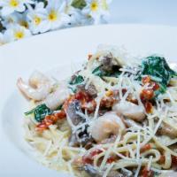Linguini con Amor · Linguini pasta with shrimp or chicken,  baby spinach, and sun dried tomato in light cream sa...