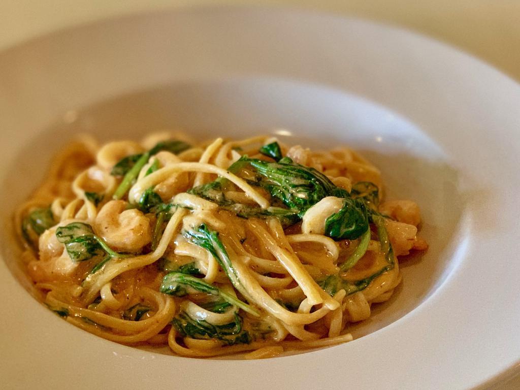 Chipotle Cream Pasta · Chipotle cream sauce, spinach and Parmesan cheese on top in penne pasta or linguini.
