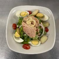 Salade Nicoise Traditionelle · Canned tuna in oil, Boston lettuce, olive, tomato, potato, onion, boiled egg.