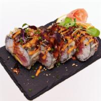 Fried Tiger Roll · Tuna, salmon, avocado, crab meat and pickled radish.