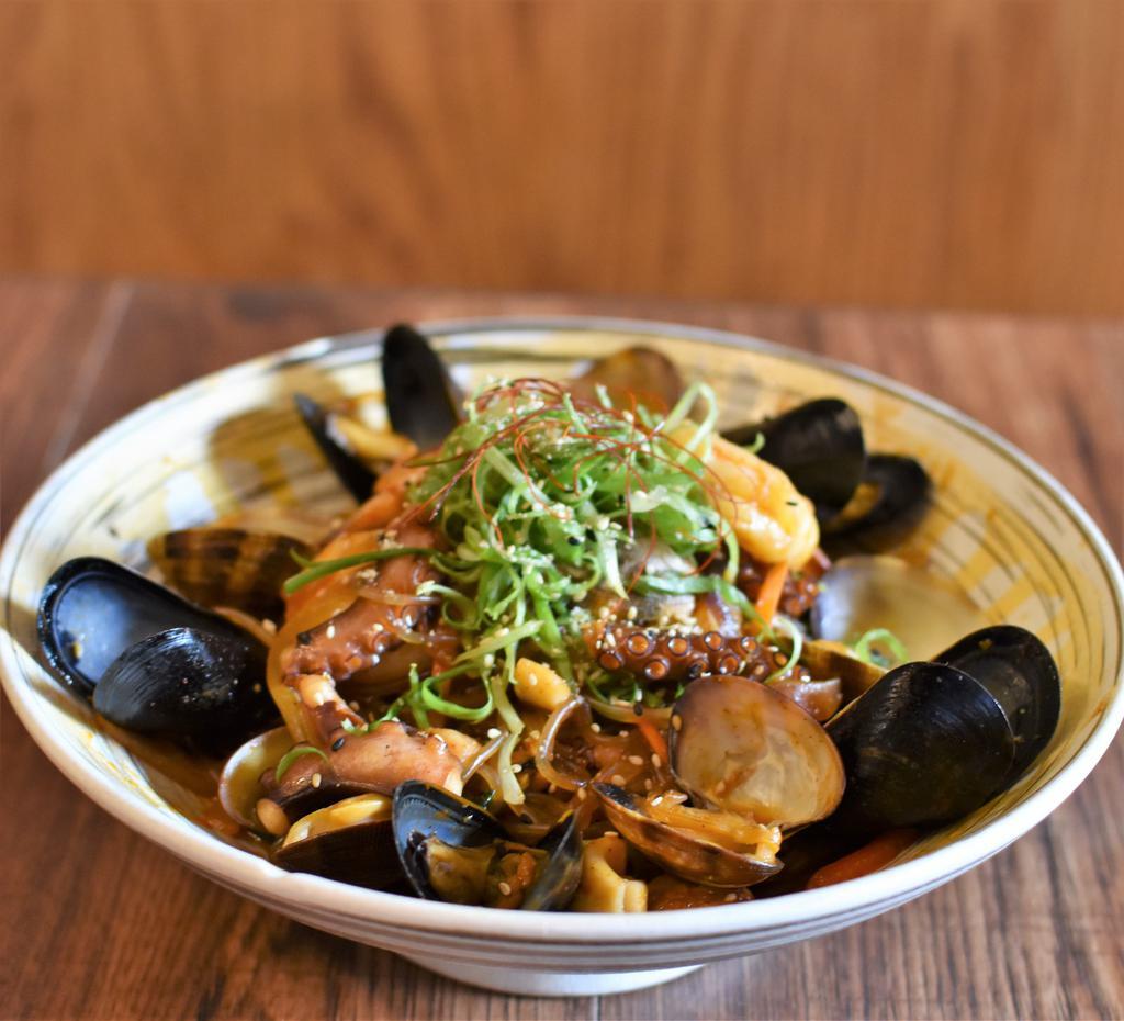 Seafood Japchae · {spicy} Napa cabbage, chinese broccoli, clams, shrimp and mussels. Sweet potato glass noodles.