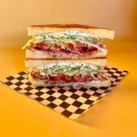 THE BUNK BLT · on Texas toast w/ shredded iceberg, bacon, tomato, and Duke’s mayo