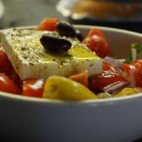 Greek Salad · Romaine, cucumbers, Kalamata olives, onions, tomatoes and feta.