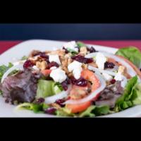 Dyre Salad · Grilled chicken, feta cheese, dry cranberries, onion, tomatoes, walnuts with balsamic vinaig...