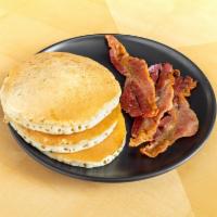 Pancake Plate · Choose a protein with 3 buttermilk pancakes, butter, and maple syrup.