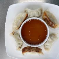 Pork and Chicken Gyoza  · 6 pork and chicken filled dumplings served with house made dipping sauce. 