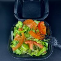Garden Salad · Iceberg lettuce, tomatoes, broccoli, onions, and green peppers with your choice of dressing.
