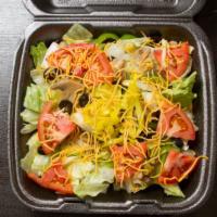 House Salad · Iceberg lettuce, ham, mushrooms, green peppers, onions, green and black olives, tomatoes and...