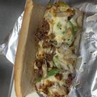 Philly Cheesesteak Sub · Philly steak, mushrooms, onion, and green peppers topped with mozzarella and Swiss cheese.