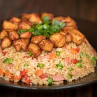 Arroz Chaufa · Peruvian fried rice mixed with veggies, eggs, sausage, and pieces of fries chicken Inka style.