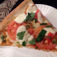 Margherita Pizza · Fresh mozzarella, fresh tomato and fresh basil. 