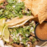 Tacos · 6” locally made warm corn tortillas served with cilantro and onions and packed with your cho...