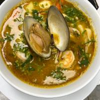 Seafood Soup · Sopa de mariscos.