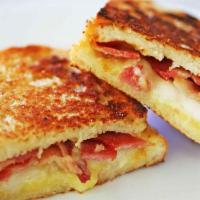 Grilled Cheese & Bacon Breakfast · Cheese cooked on a rack over a grill. Cured pork.