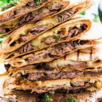 Lamb Quesadillas · White sauce, green peppers, onions, lettuce and tomatoes.
