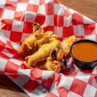 Texas Hot Wings · Cooked wing of a chicken coated in sauce or seasoning.