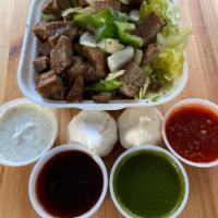 kids lamb over rice · grilled Lamb with sautéed onions and green peppers over rice with salad ( lettuce , tomato, ...